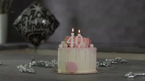 Decorated Birthday Cake with Candles and Macarons