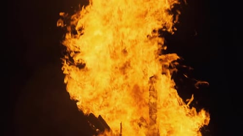 Big Bonfire Burning at Night. Slow Motion. The Big Fire Background.
