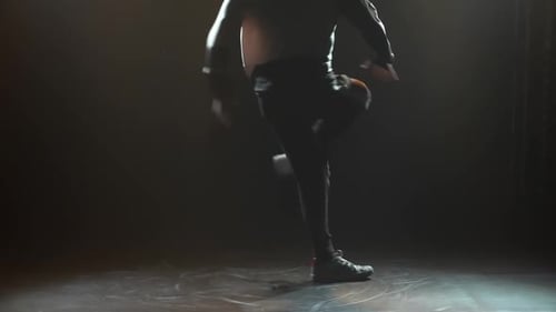 Stylish Young Man Alone Dancing Street Breakdance, Hip Hop in the Studio. Silhouette of a Man