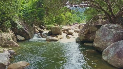 Drone Moves Down Stream of Rough Foamy Mountain River