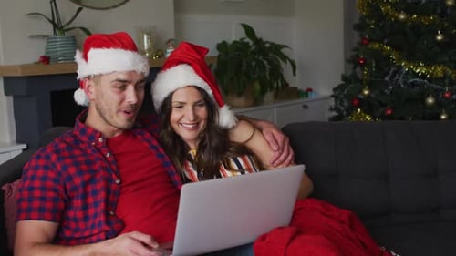 Happy Couple Relaxing at Home During Christmas