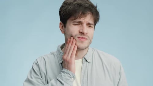 Young Adult Experiencing Dental Pain