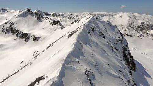 Majestic Aerial View of Snow Covered Mountains