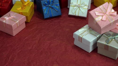 Collection of colorful gift boxes on red background