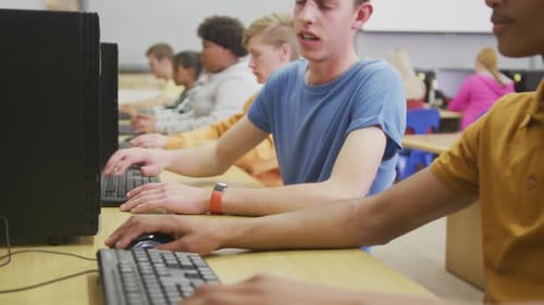 Students working on computers in high school class