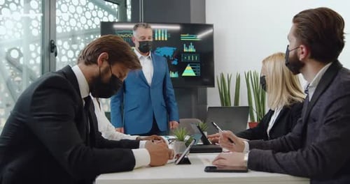 Business Team Celebrates Success in Modern Office