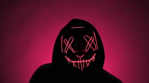 Sinister Hooded Figure with Glowing Mask on Magenta
