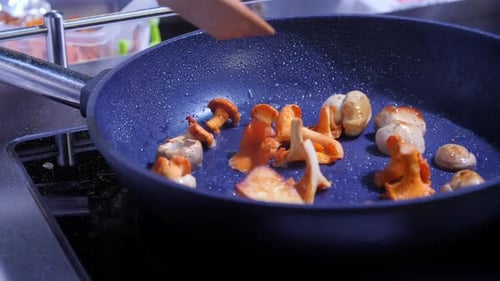 the Chef Fries Wild Mushrooms in a Pan