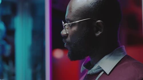 Diverse Data Center Technicians Speaking in Server Room