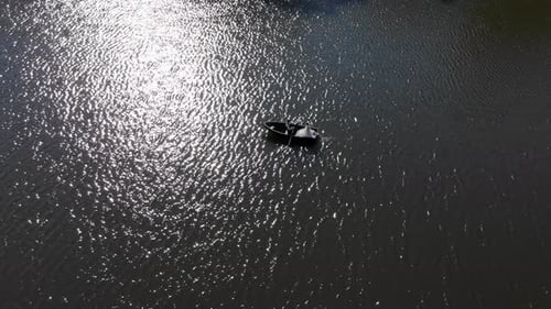 Rowboat Ride on Shimmering Lake Water