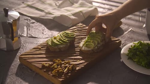 Taking Avocado Toast on Cutting Board