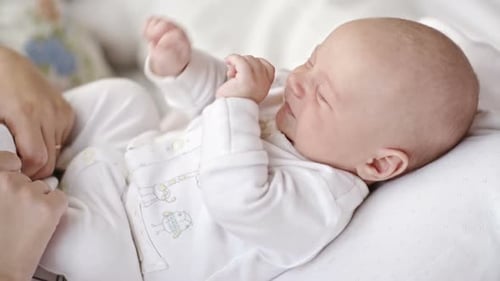 Sleepy Infant on Mothers Laps