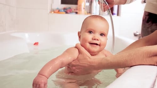 Adorable Baby Taking a Bath with Shower