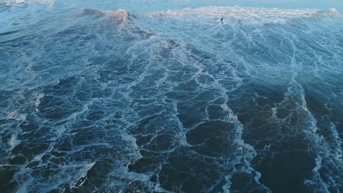 Aerial Top View on Big Ocean Waves and Scooter