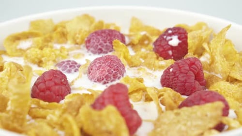 Breakfast Bowl Cornflakes with Raspberries and Milk