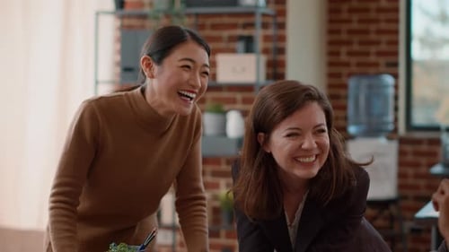 Happy Women Talking to Office Colleagues on Break