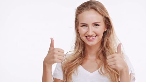Smiling Woman Gives Double Thumbs Up