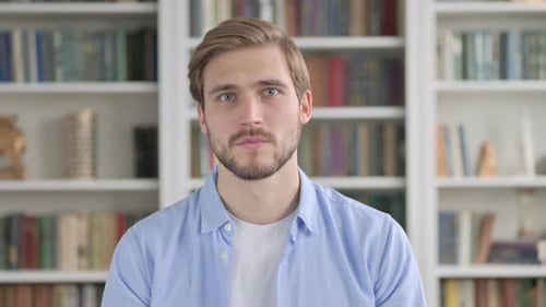 Man Reacts with Shock and Surprise Indoors