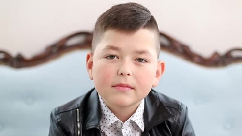 Boy Looking at Camera Indoors Close Up