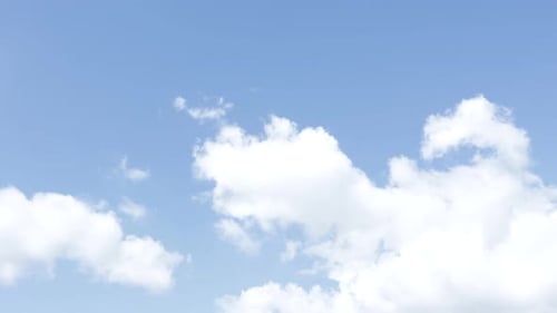 Clouds Drifting Slowly Across a Blue Sky
