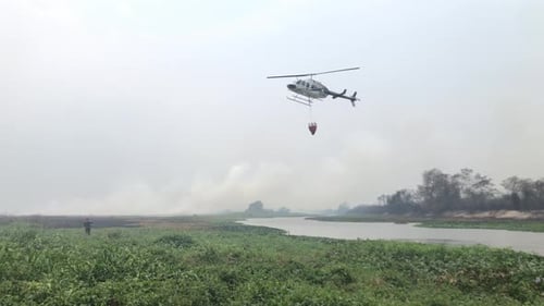 Helicopter fire fight in the wild