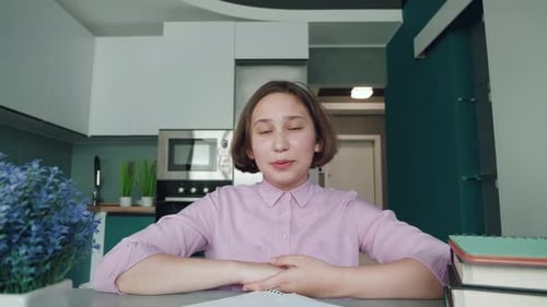 Girl Waving and Talking During Video Call at Home