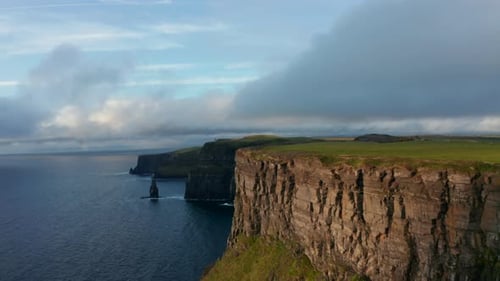 Beautiful Footage of Sea Coast with High Rocky Cliffs at Sunset