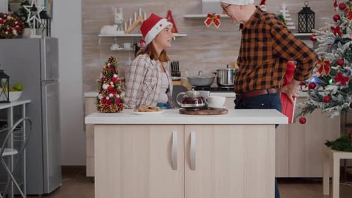 Grandfather Giving Christmas Gifts to Granddaughter