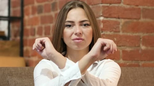 Woman Making X Sign with Arms