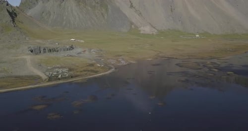 Aerial view approaching a mountain range.