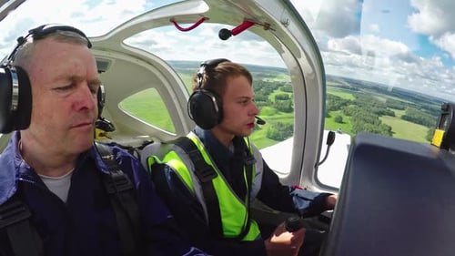 Novice Pilot Aviating Plane with Flight Instructor