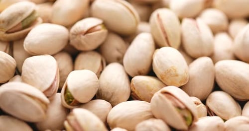 Pile of Creamy Pistachios Nuts in Close Up
