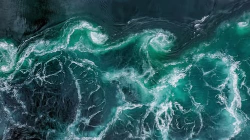 Waves of Water of the River and the Sea Meet Each Other During High Tide and Low Tide