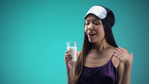Smiling Woman Drinking Warm Milk for Better Sleeping, Calcium and Vitamin Source