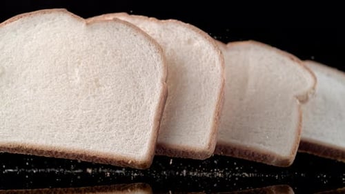 Slices of white bread falling. Slow Motion.