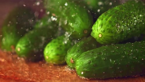 Fresh Green Cucumbers Being Washed With Water