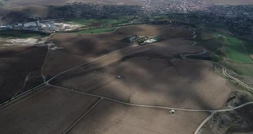 Vast Field And Cloud Shadows Aerial View