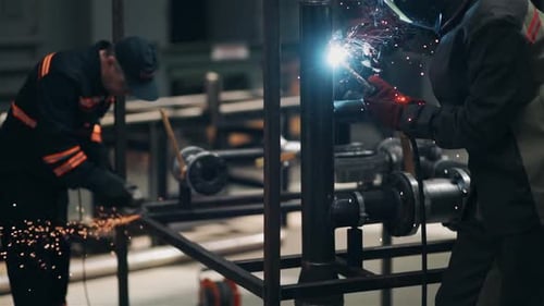 Masters in the Workshop Perform Cutting and Welding of Metal
