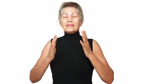 Smiling Senior Woman Practicing Yoga Meditation