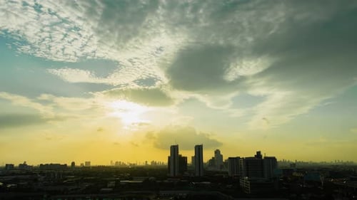 Time lapse sunset sunrise and beautiful twilight fluffy storm cloudy blue and yellow sky