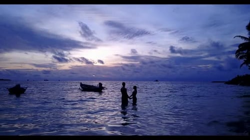 Man and woman in love on marine island beach adventure by blue sea and white sandy background of the