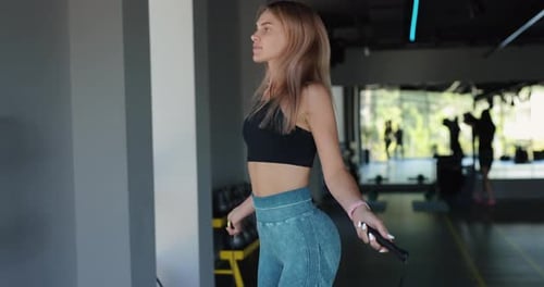 Woman Make Rope Jump in the Gym