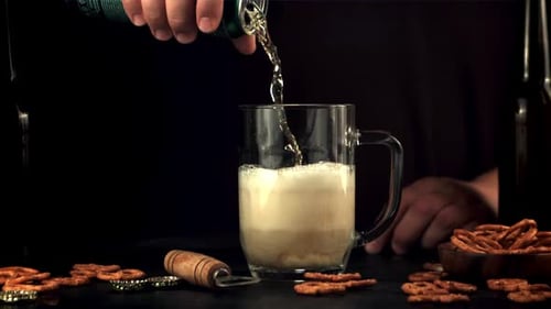 Beer Being Poured into a Glass Mug