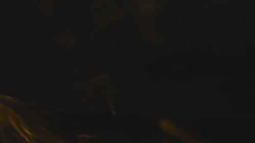 Abstract Orange Smoke on Black Background
