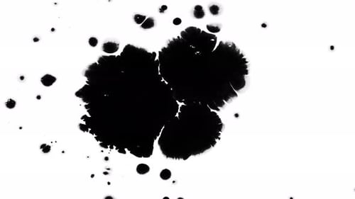 Black Ink Spreading on White Surface