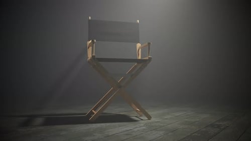 Empty Director's Chair with Dramatic Spotlight on Smoky Stage