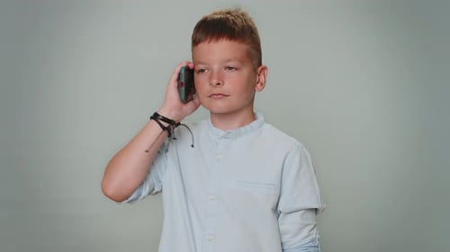 Boy Chatting on a Smart Phone Smiling