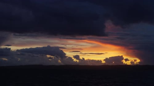 Dramatic Sky Over Water at Golden Hour