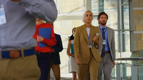 Business people walking in the corridor at office 4k