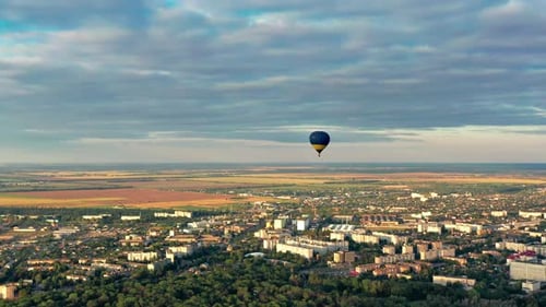 Scenic Hot Air Balloon Flight Over Urban Landscape
